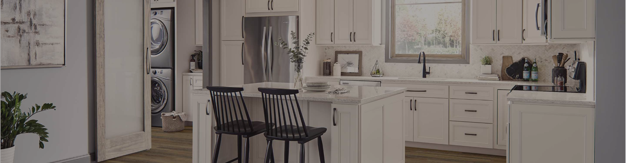 White cabinetry in a kitchen with white countertops