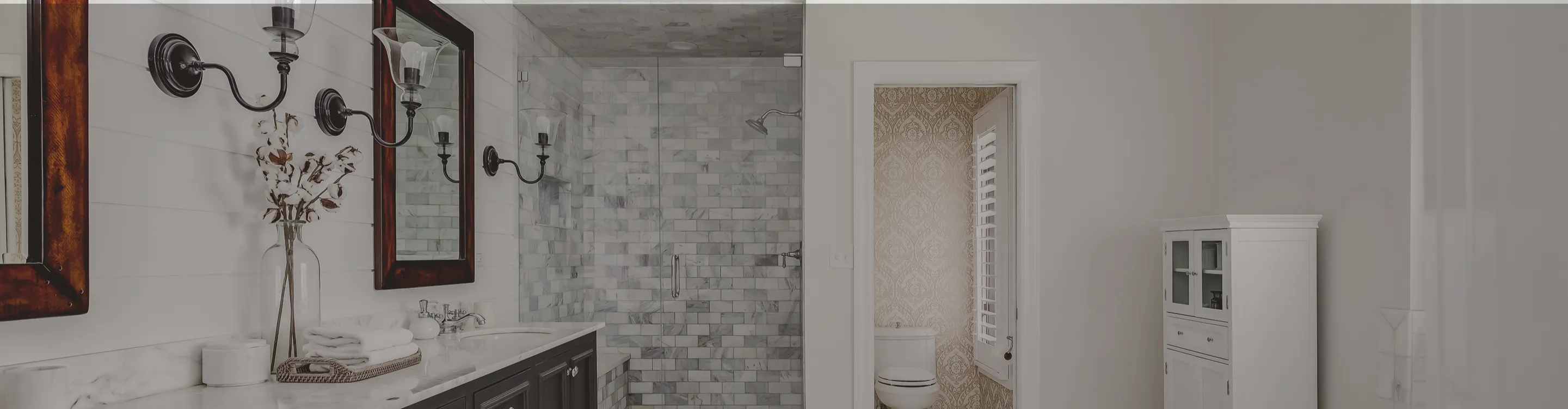 gray and white custom tile shower in a bathroom with tile flooring